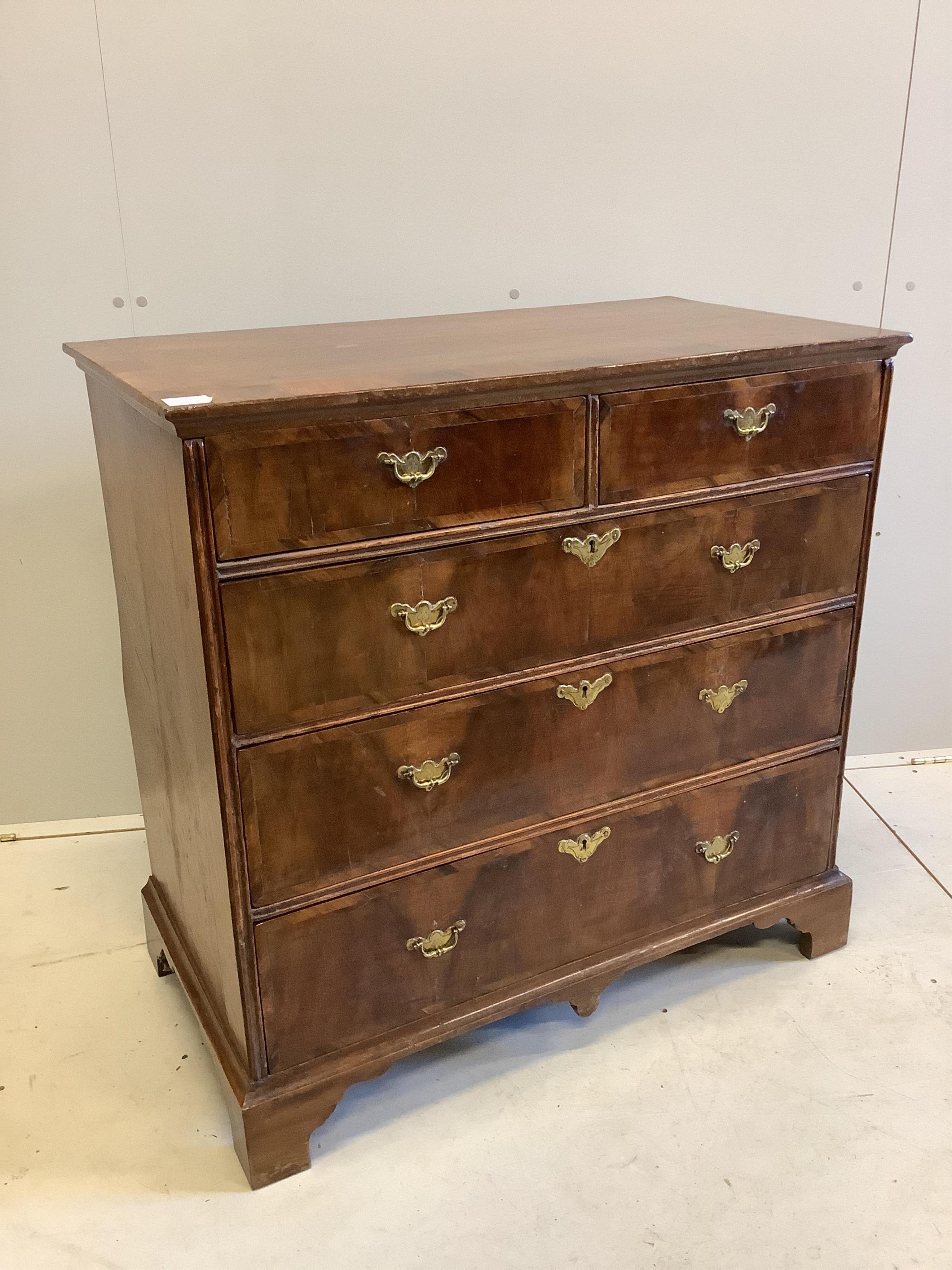 An early 18th century banded walnut chest, fitted two short and three long drawers, width 90cm, depth 49cm, height 89cm. Condition - good